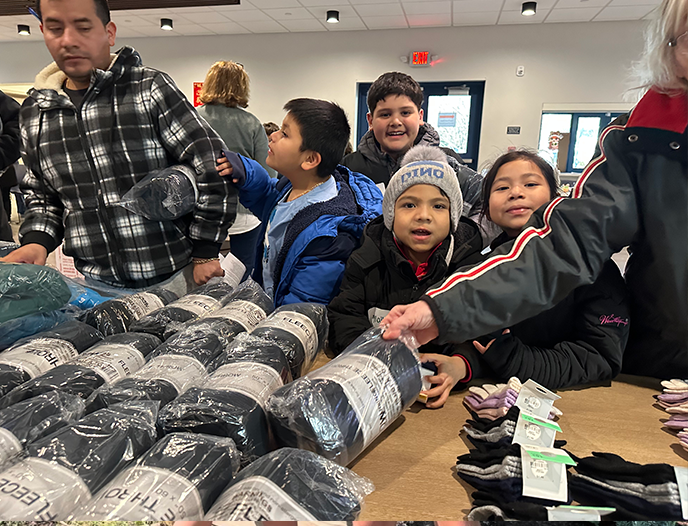 Clothing giveaway, boys smiling